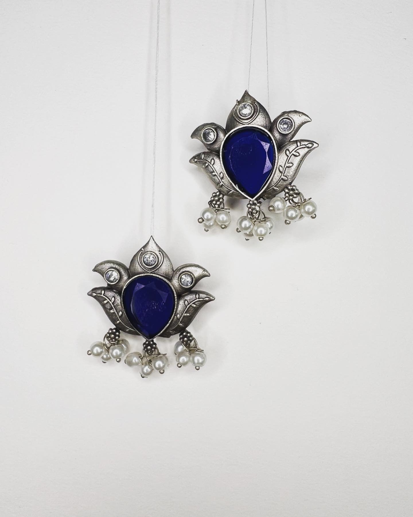 Blue stone lotus earrings